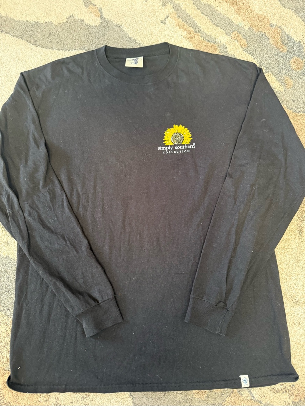 Simply Southern Black Long Sleeve Tee with Sunflower Logo on Front and back.